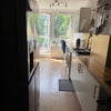 Photo 4: Kitchrn. Big fridge freezer and electric cooker
