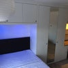 Photo 1: modern fully intergrated workspace, bed area and floor to ceiling triple wardrobe 