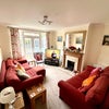 Photo 9: Lounge/tv room with fire place 
