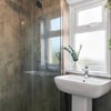 Photo 4: Nice big shower to relax under in one of two bathrooms in the house.
