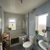Photo 7: Bathroom - Dated, but new shower put in. 