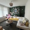 Photo 4: Living Room - sofa covered due to current housemate's dog, will be removed. 