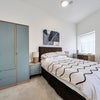 Photo 4: Bedroom 4 Modern furnished bedroom designed for longer stays.