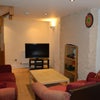 Photo 2: warm lounge with TV