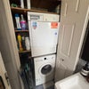 Photo 5: We have a washer and dryer in our bathroom