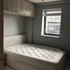 Photo 5: Bedroom (including ottoman and overhead storage)