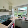 Photo 7: Kitchen overlooking grassed communal garden 