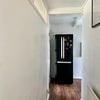 Photo 4: Light and airy hallway with double door fridge 