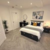 Photo 5: Bedroom / Storage double bed / Fitted wardrobe / Hanging rails & shelves