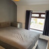 Photo 2: Double bedroom with shower