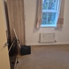Photo 2: The wardrobe and curtains are included 