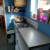 Photo 7: Utility room with kitchen behind