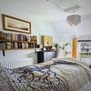 Photo 2: Double bedroom with fireplace and sloped ceiling 