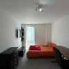 Photo 7: Room 3. Bed, wall tv, table and storage