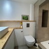 Photo 4: Downstairs bathroom (with shower and washing machine) 