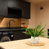 Photo 13: COMMUNAL KITCHEN