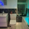 Photo 3: Modern bathroom with Bluetooth mirror, fresh towels and daily cleaning.