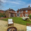 Photo 4: Garden (showing the garden room/second lounge)