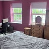 Photo 3: Desk with swivel chair. Plenty of natural light from four windows.