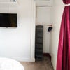 Photo 4: built-in wardrobe with dual hanging rails, high-level cupboard storage