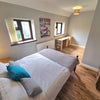 Photo 2: The room is fully furnished including a double bed, bedside table, chest of draws and a wardrobe.