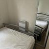 Photo 9: Radiator at the foot of the bed 
