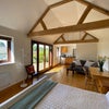 Photo 5: Studio with double bed, wardrobe, sofa and desk