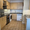 Photo 2: Kitchen with dishwasher, Washerdryer, cooker, fridge freezer