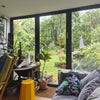 Photo 2: The sunroom and garden view