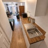 Photo 4: Includes Kitchenette w/ Counter top hob and oven