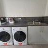 Photo 9: Communal Laundry Room