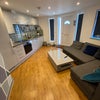 Photo 1: Open plan living room and kitchen