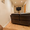 Photo 9: Smaller TV room - sofas are recliners