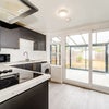 Photo 6: Big, open plan kitchen leading out onto the conservatory, creating a naturally lit kitchen.
