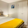 Photo 6: Room 6 - showing built-in wardrobe. 
