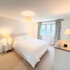 Photo 6: Spacious bedroom with King size bed and walk in wardrobe