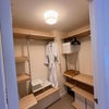 Photo 9: Walk in wardrobe with hanging space and shelves