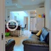 Photo 2: View of the living room and kitchen