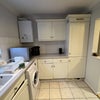 Photo 4: Right side of kitchen. 