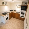 Photo 6: GF - Separate communal kitchen and laundry facilities