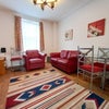 Photo 3: Spacious Lounge with big TV