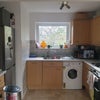 Photo 4: Kitchen with fotted dishwasher and washkng machine 