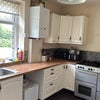 Photo 4: Kitchen with large oven - tall fridge on backwall