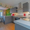 Photo 3: Fully equipped kitchen with Miele washer - dryer