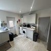 Photo 7: Kitchen comes with Common bathroom and washing machine and dryer
