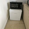 Photo 7: Microwave and small fridge