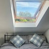 Photo 3: King size bed with velux window above (with blackout blinds)