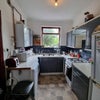 Photo 7: Kitchen looking south.