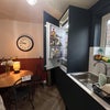 Photo 7: Fridge and dining table