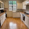 Photo 2: Kitchen - balcony in background